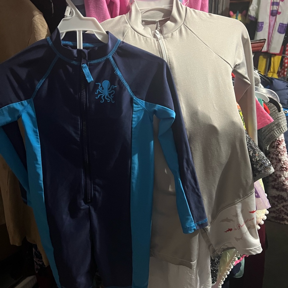 2 boys one piece swim suits. Long sleeve one grey one blue